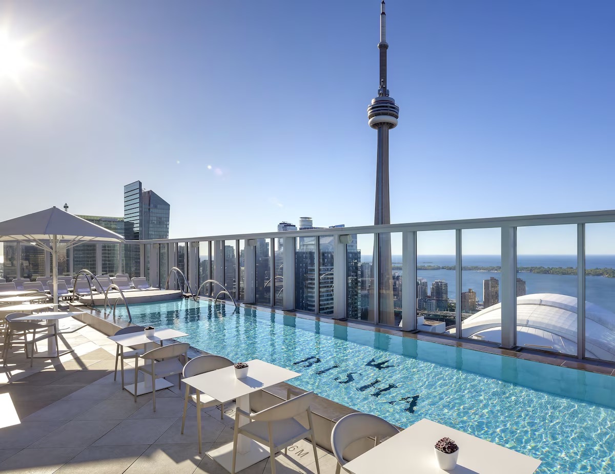 Rooftop infinity pool at Bisha Hotel Toronto with CN Tower view